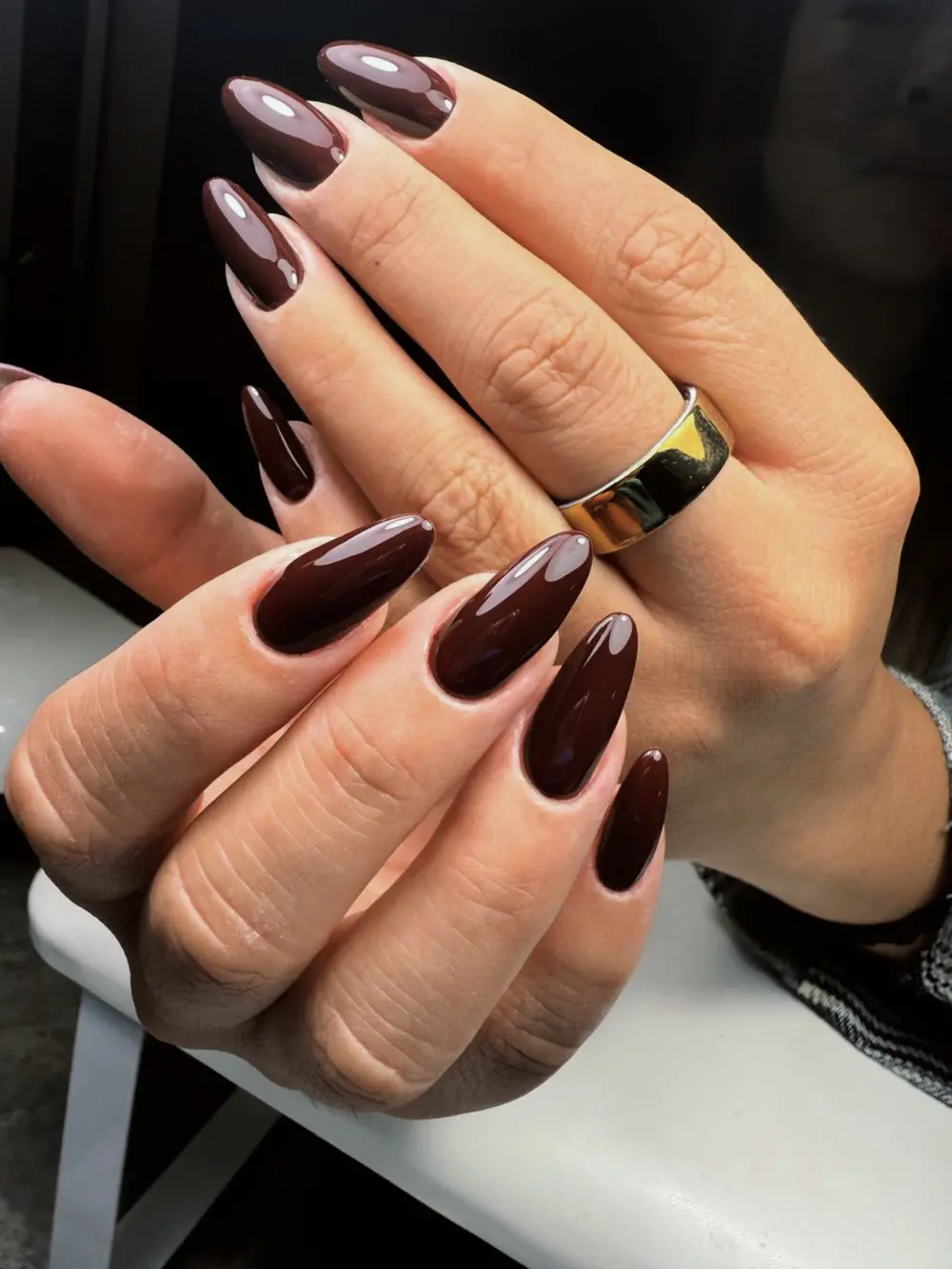 Glossy dark-cherry almond nails, freshly finished
