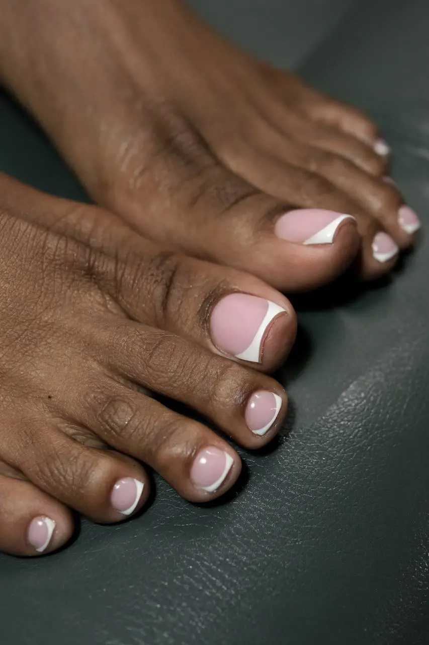 Pink-and-white French pedicure, close-up